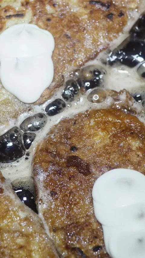 White bread with an egg and mayonnaise frying in sunflower oil in a hot pan. Stock Footage 348486202
