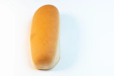 White bread on isolated background. Bun for hot-dog. Top view. Close-up. Spac Stock Photos