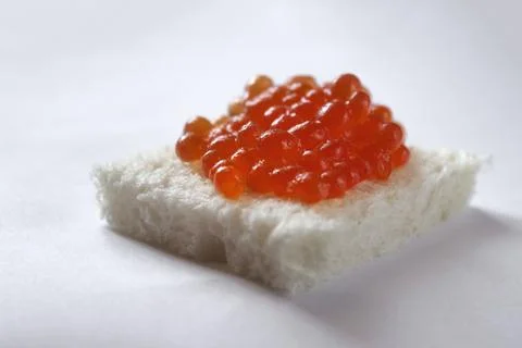 White bread with red caviar Stock Photos