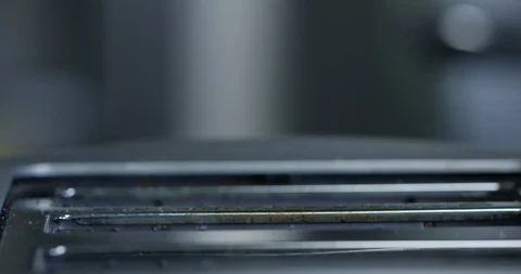 White bread rises up from toaster - side profile Stock Footage 101268403