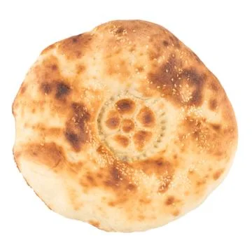 White bread. The Uzbek flat cake on a white background. Stock Photos
