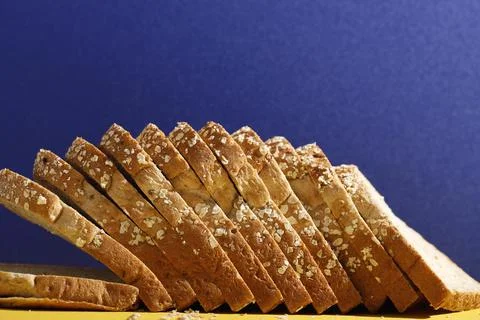 White Bread with Whole Grain Cereal on Blue Background Foto stock