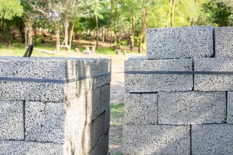 White brick for construction. Cinder blocks stacked on pallets were purchased Stock Photos