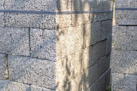 White brick for construction. Cinder blocks stacked on pallets were purchased Stock Photos