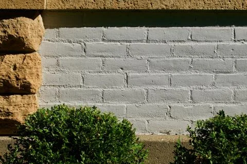 White brick surrounded by limestone block trim Stock Photos
