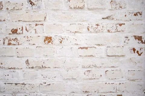 White brick wall background with brown scuff elements 스톡 사진