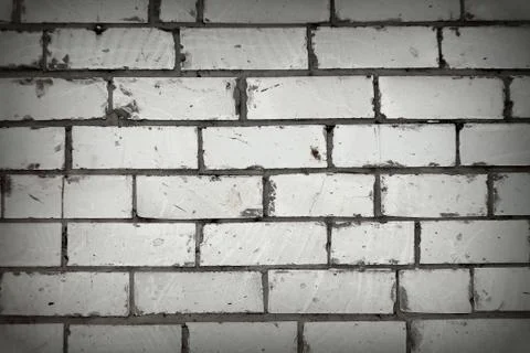 White brick wall, background with a rough brickwork texture. Stock Photos