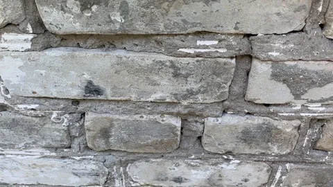 White brick wall on camera in downward motion Stock Footage 128818976