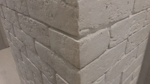 White Brick Wall Corner with Rough Textured Bricks and White Seams Stock Footage 123111310