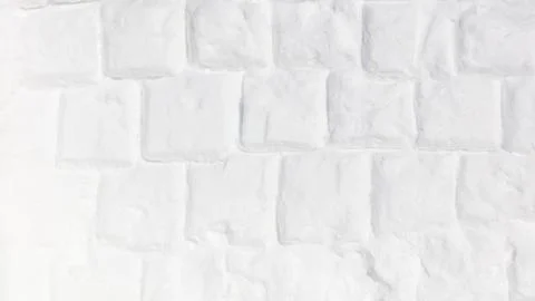 White brick wall crafted from snow. Snow forms each textured block with fro.. 스톡 사진