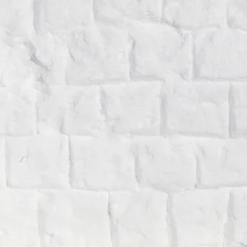 White brick wall crafted from snow. Snow forms each textured block with fro.. 스톡 사진