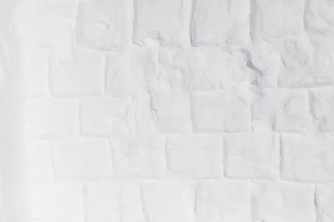 White brick wall crafted from snow. Snow forms each textured block with fro.. Stock Photos