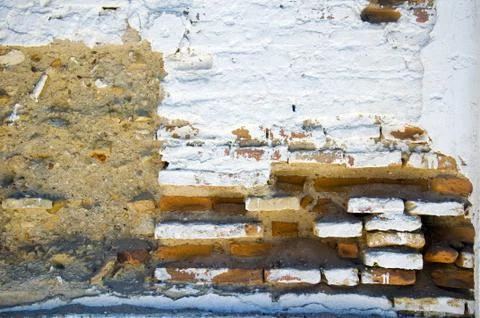 White brick wall with different textured surface Stock Photos
