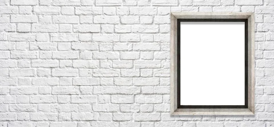 White brick wall with a frame to insert pictures and text 스톡 사진