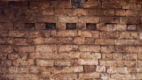 White brick wall with holed in the middle Stock Photos