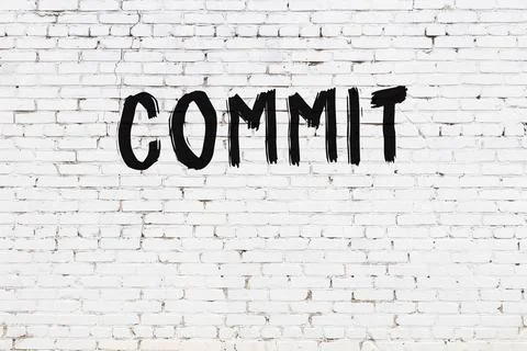  White brick wall with inscription commit handwritten with black paint Stock Illustration