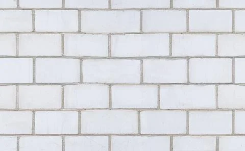 White brick wall seamless texture. White concrete wall texture background. Stock Photos