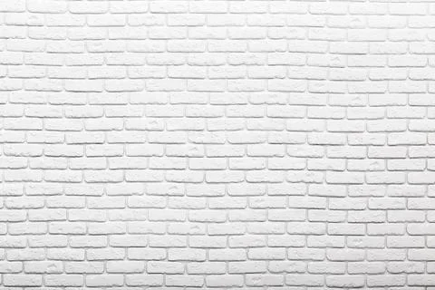 White brick wall with a smooth texture, suitable for background designs and Stock Photos
