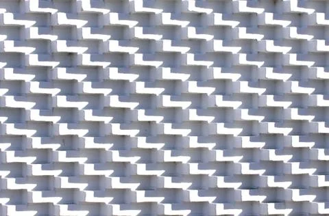 White brick wall in unusual pattern with bricks sticking out Stock Photos