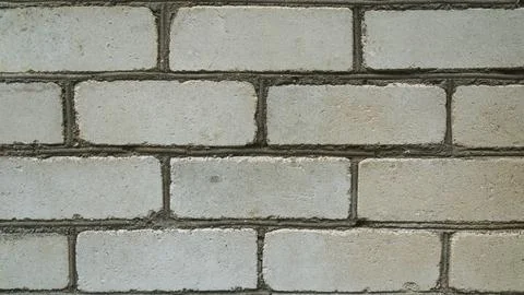 A white brick wall. White brick. The background is a white brick wall. Close  Stock Photos
