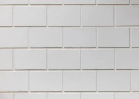 A white brick wall with a white brick pattern Foto stock