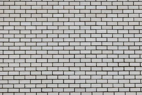 White bricks form a clean, repeating pattern Stock Photos