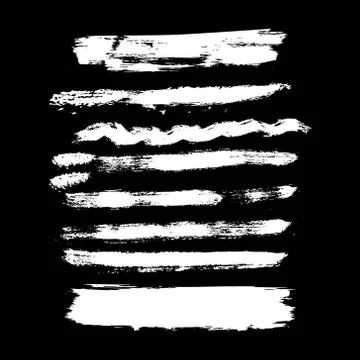 White brush stroke set isolated on black background. Stock Illustration