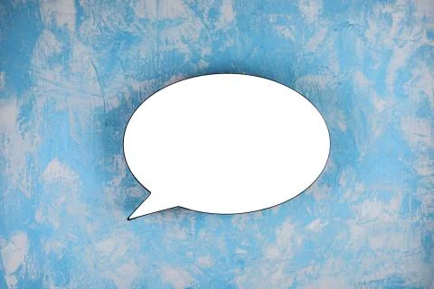 White bubble on the blue textured background. Copy space. Stock Photos
