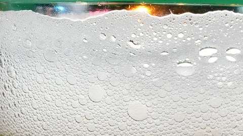White bubbles of beer in the glass, 動画素材 95683468