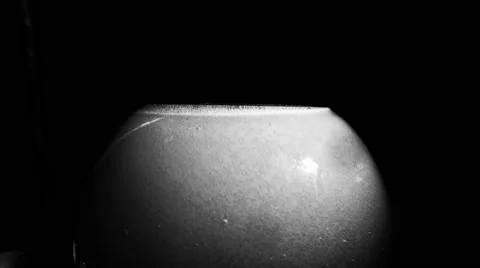 White Bubbles of Boiling Water in Flask With on a Black Background Stock Footage 61312176