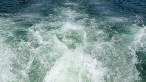 White bubbles coming from the seawater Stock Footage 74502796