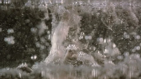 White bubbles descending and foam ascending, macro Stock Footage 62405931