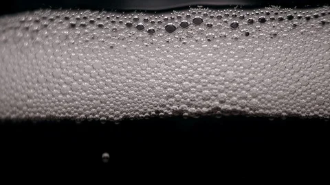 White bubbles floating on a liquid. Stock Footage 89307767