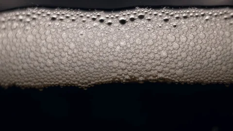 White bubbles floating on a liquid. 스톡 동영상 89310624