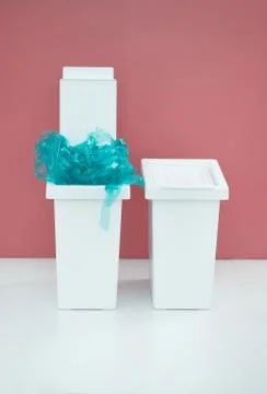 White bucket for sorting recyclables for plastic on a red background with emt Stock Photos
