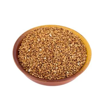 White Buckwheat on brown, ceramic, deep, plate isolated on white background Foto stock