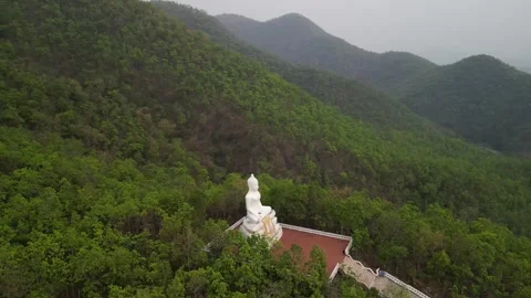White Buddha in Mountains 動画素材 262560164