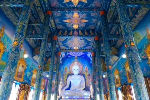 The white buddha statue inside the Hall in Blue temple Stock Photos