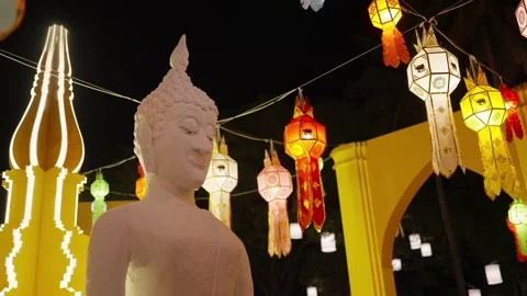White Buddha Statue Surrounded by a Lanterns, Beautifully Against the Night Sky Stock-Footage 319329494
