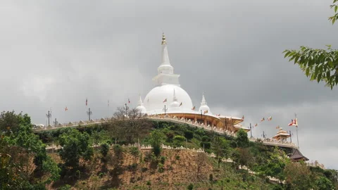 White buddhist stupa temple on a hilltop in sri lanka Stock Footage 340642923
