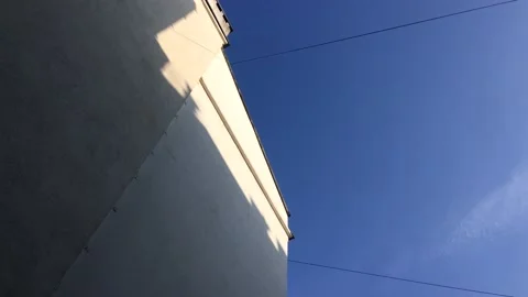 White building against the blue sky Stock Footage 154304514