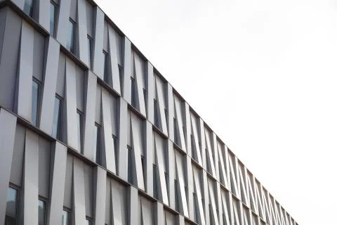 White building facade with beautiful pattern design diagonal shot during day Stock Photos