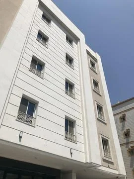 The white building with windows view Stock Photos