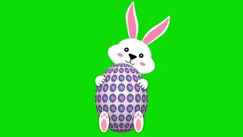 White bunny with decorated easter egg and smiley face on green screen Stock Footage 306079180