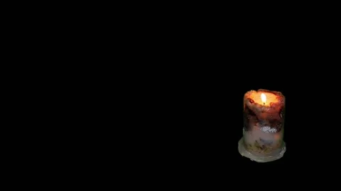 White burning candle on a black background. Mourning, burning candle. Video stock 167017067