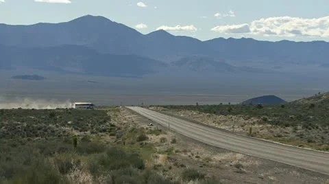The White Bus 5 Turning onto Highway 375 from Groom Lake Rd. Stock Footage 10984360