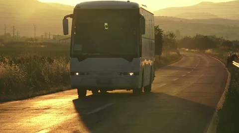 White bus in the rush hour on the highway at dusk Stock Footage 64915872