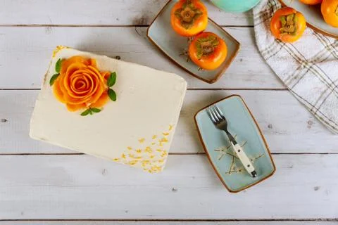 White buttercream rectangular cake whit roses flower from persimmon. Stock Photos