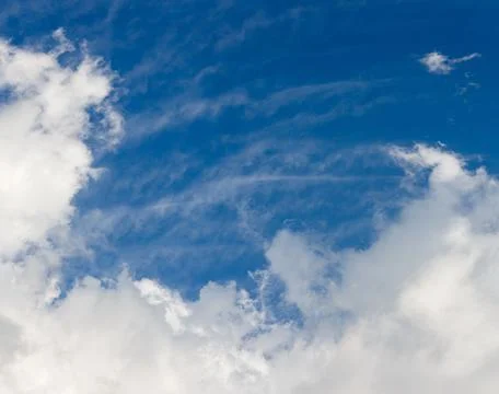 White c cumulus clouds on blue sky background Stock Photos
