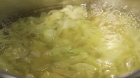 White cabbage and potatoes being cooked in meat stock Stock Footage 24671289